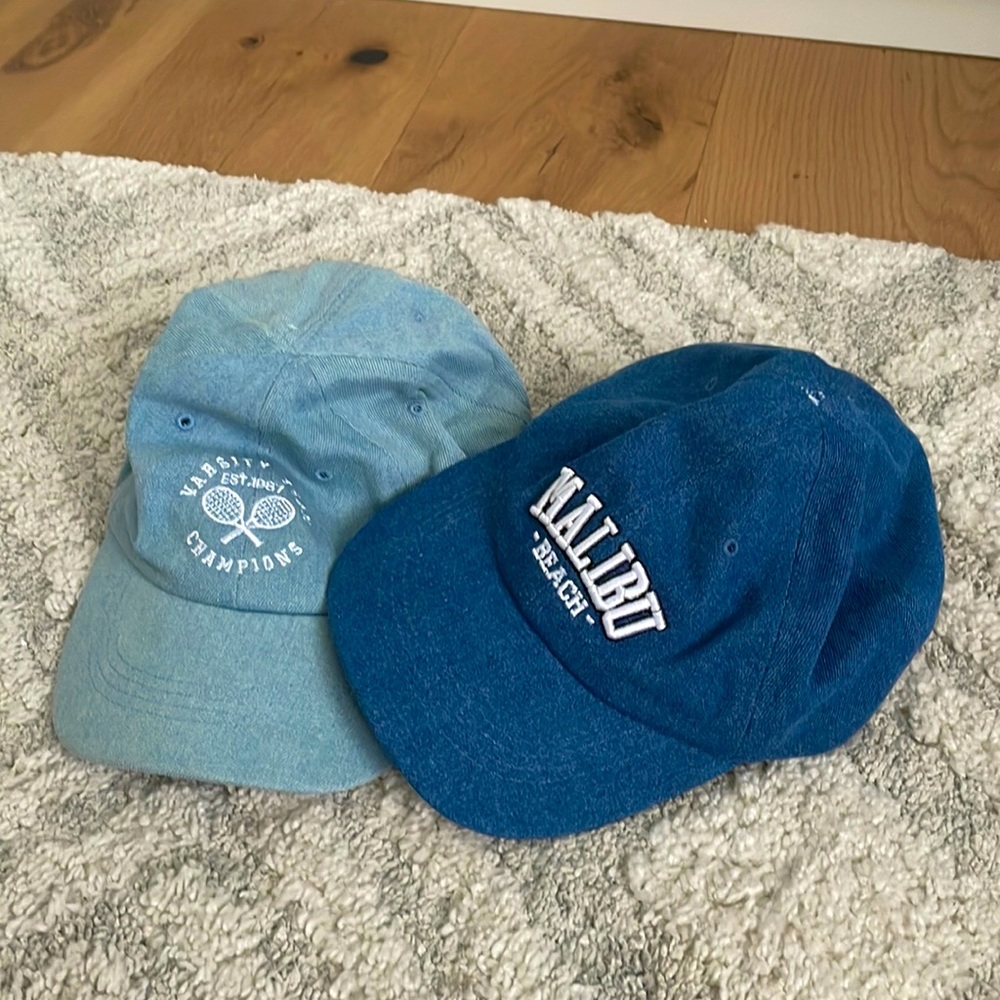 Two blue Urban Planet Ball caps